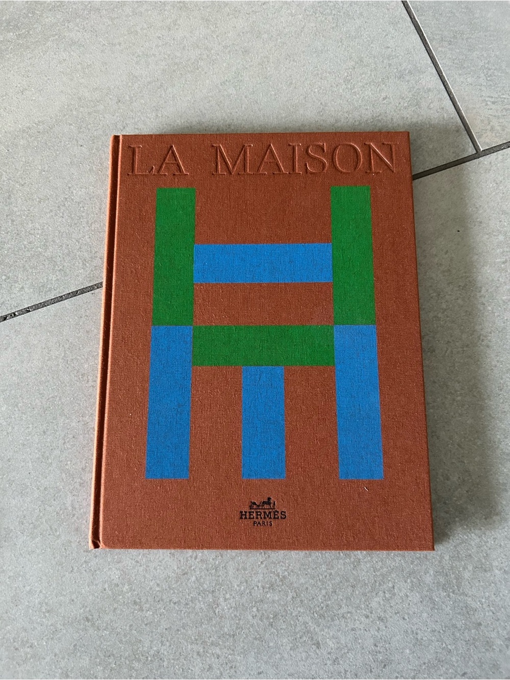 Hermes Terracotta Book Cover with Blue & Green Graphic